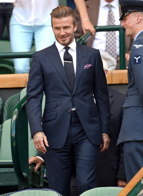 navy suit and black tie